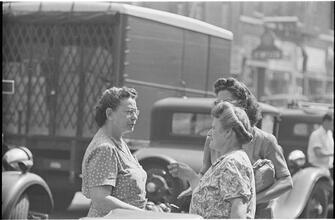 Street Conversations [Three women talking on the street.]