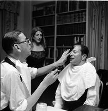 Beaux Arts Ball [Members of the Architectural League of New York putting on makeup at a costume party.]