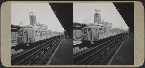 Elevated train approaching Queens Plaza station.