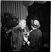 Champagne Cholly Book Party [Two women talking.]