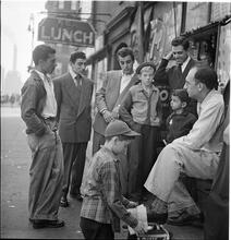 Shoe Shine Boy [Mickey shining shoes.]