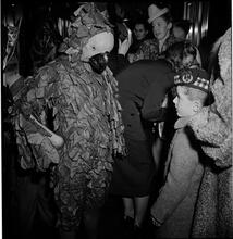 United Nations Children's Party [Child talking to a man in a parrot costume.]